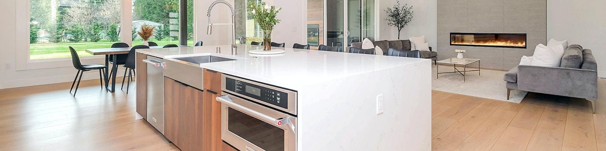 Modern open concept kitchen with wood-look floors